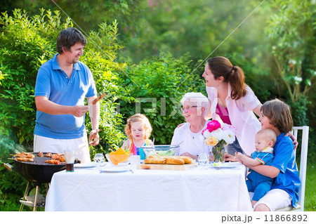 Big family grilling meat for lunch 11866892