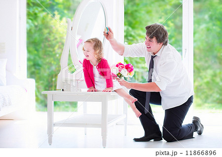 Father brushing his daughter hair Father brushing his daughter hair 11866896