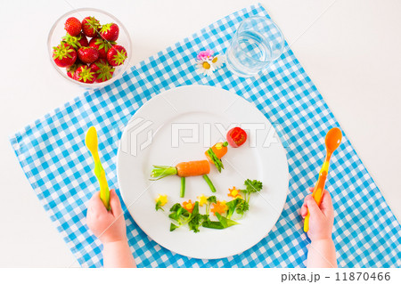 Child's hand and healthy vegetable lunch Child's hand and healthy vegetable lunch 11870466