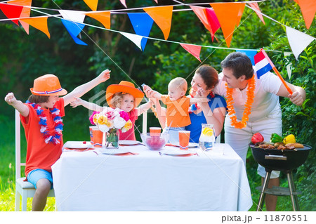 Dutch family having grill party Dutch family having grill party 11870551
