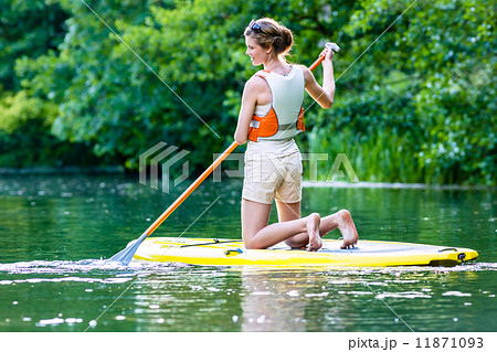 Woman with stand up paddle board sup on river 11871093