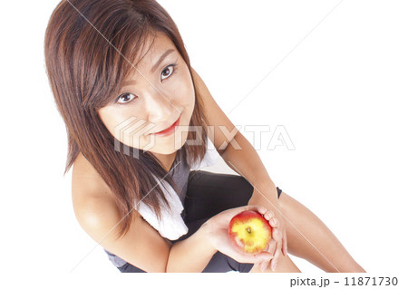 Young and fit pretty girl in exercise outfit holding red apple Young and fit pretty girl in exercise outfit holding red apple 11871730