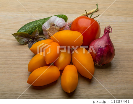 Yellow tomatoes on the board 11887441