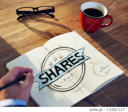 Businessman's table with Shares Concept Businessman's table with Shares Concept 11891127
