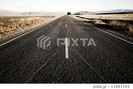 Sepia Toned Picture Of A Road That Leads To The Mountain Ranges 11891503