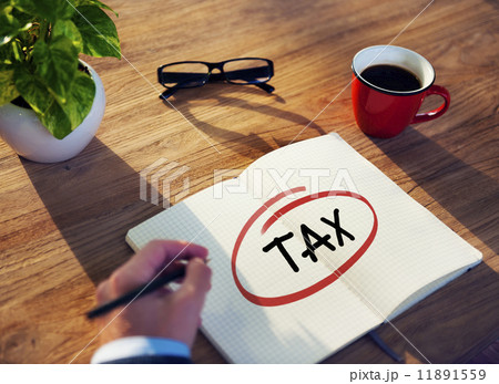 Businessman Writing the Word "Tax" 11891559