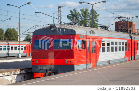 Modern red suburban electric train standing at the station in Ru Modern red suburban electric train standing at the station in Ru 11892503