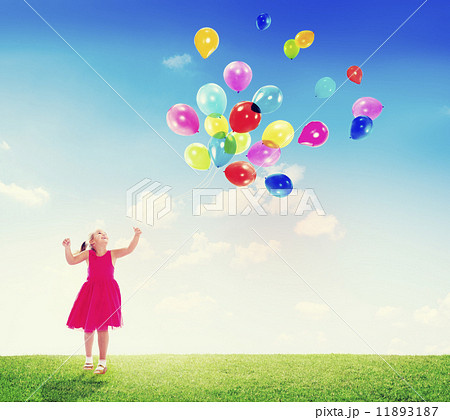 Little Girl Playing with Balloons Outdoors Little Girl Playing with Balloons Outdoors 11893187