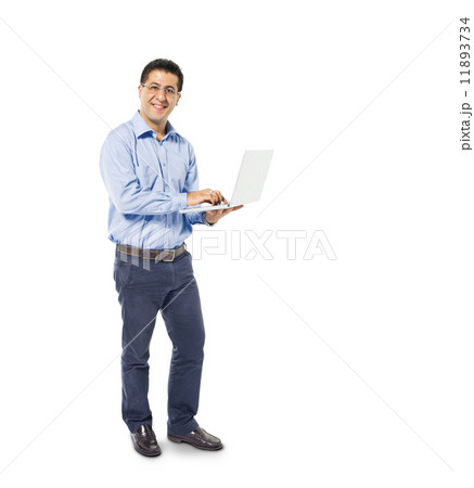 A Smart Casual Mans Standing while using his Laptop A Smart Casual Mans Standing while using his Laptop 11893734