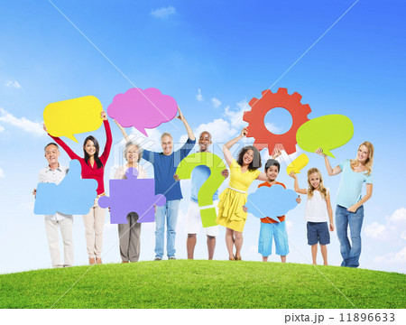 Diverse People Holding Symbols On a Hill Diverse People Holding Symbols On a Hill 11896633