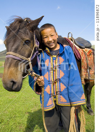 Little Boy Tilting His Head To His Horse And Smiling At Outdoors 11896872