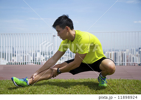 Young Asian man stretching his leg 11898924
