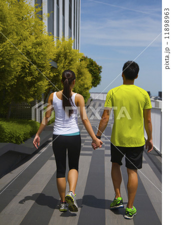 Young Asian Adults holding hands after exercising 11898963