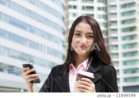 Business woman holding coffee paper cup 11899599