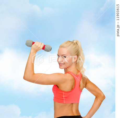 young sporty woman with light dumbbell 11903615
