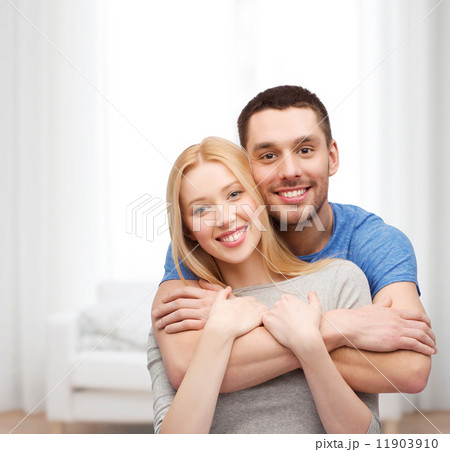 smiling couple hugging smiling couple hugging 11903910