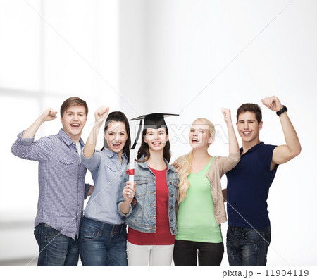 group of standing smiling students with diploma 11904119