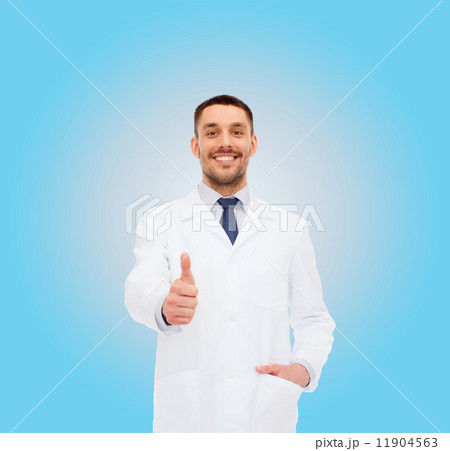 smiling male doctor showing thumbs up smiling male doctor showing thumbs up 11904563
