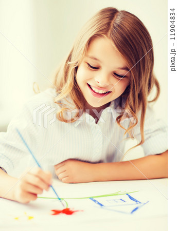 little girl painting at school little girl painting at school 11904834