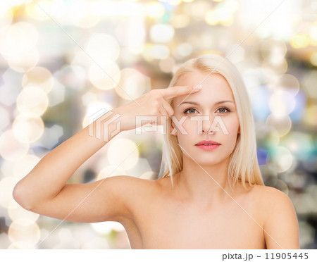 beautiful woman touching her forehead 11905445