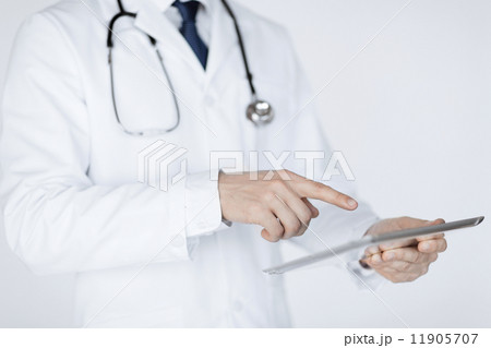 male doctor holding tablet pc male doctor holding tablet pc 11905707