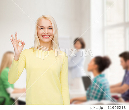 young businesswoman showing ok sign young businesswoman showing ok sign 11906218