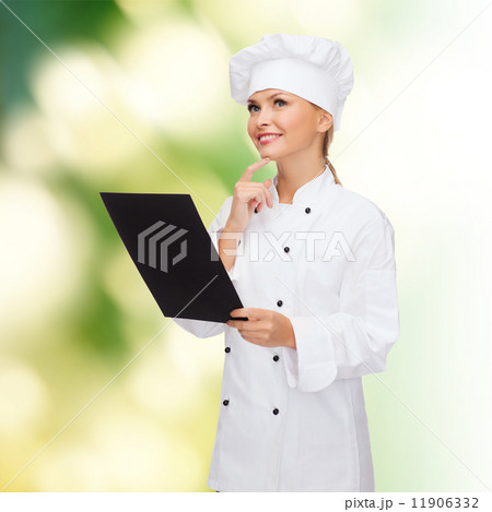 smiling female chef with black blank paper smiling female chef with black blank paper 11906332