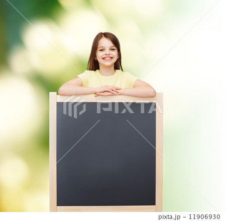happy little girl with blank blackboard 11906930