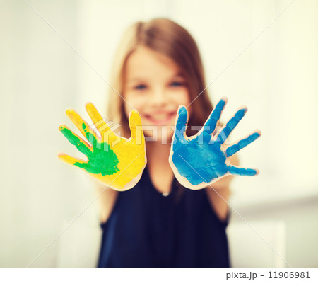 girl showing painted hands 11906981