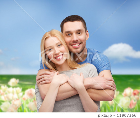 smiling couple hugging 11907366