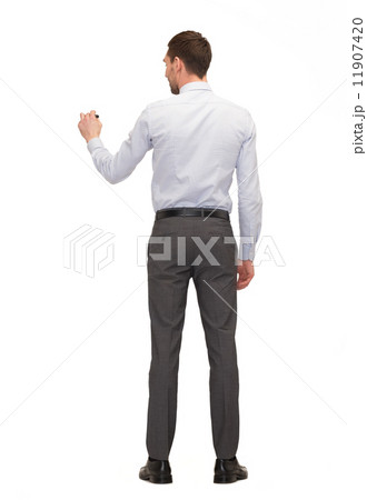 businessman or teacher with marker from back 11907420