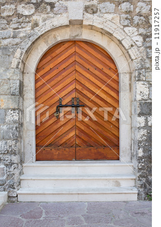 wooden door in stone wall 11917257