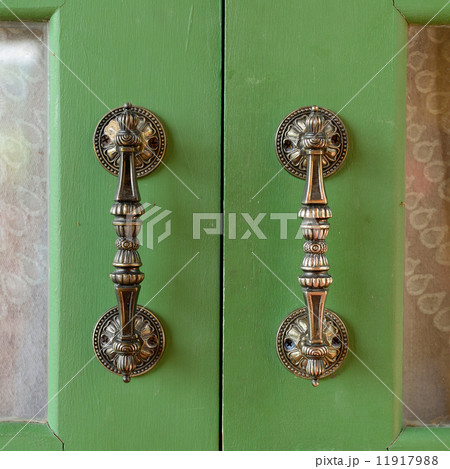 Door handle on green wooden door Door handle on green wooden door 11917988