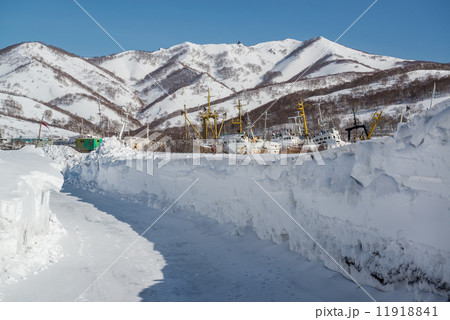 Ship graveyard and snowy mountains 11918841