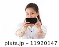 Asian woman using smart phone 11920147