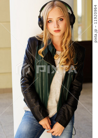 Young happy teenager is wearing headphones Young happy teenager is wearing headphones 11920964