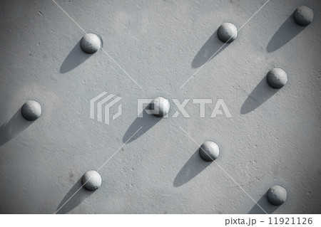 Abstract gray background, riveted metal textured. 11921126