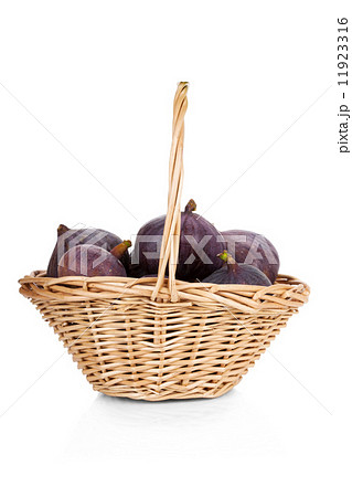 Figs in a basket isolated on white background Figs in a basket isolated on white background 11923316