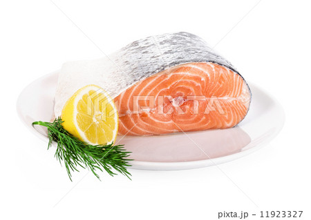 Raw steak of salmon on white plate isolated 11923327