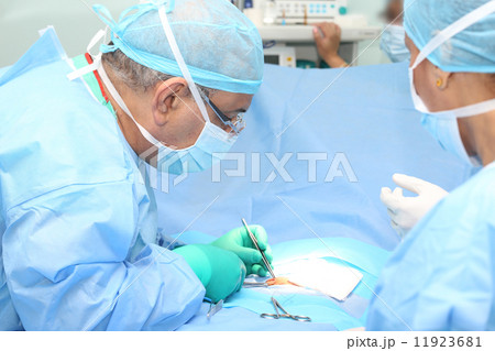 Doctor making a suture in operation room 11923681