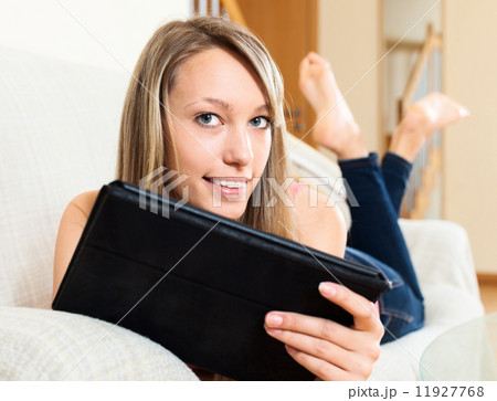 Young woman browsing web with tablet 11927768