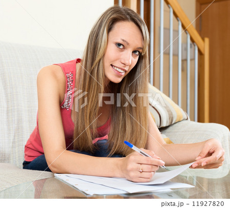 woman editing documents at table 11927820