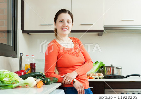 woman with fresh vegetables in kitchen 11928205