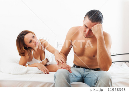Man has sad, woman consoling him 11928343