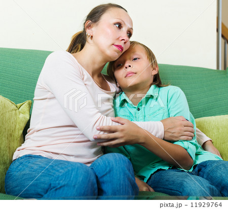 mother consoling sad teenage son mother consoling sad teenage son 11929764