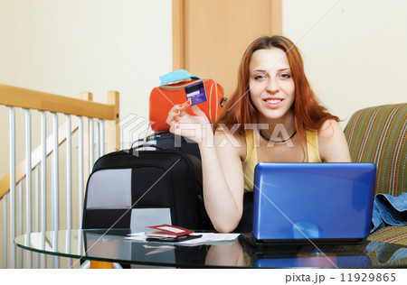 Woman buying tickets online Woman buying tickets online 11929865
