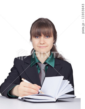 Young woman - student does records in notebook Young woman - student does records in notebook 11933643