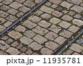 old tram rails on cobblestone 11935781