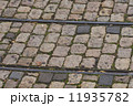 old tram rails on cobblestone 11935782