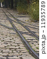 old tram rails on cobblestone 11935789